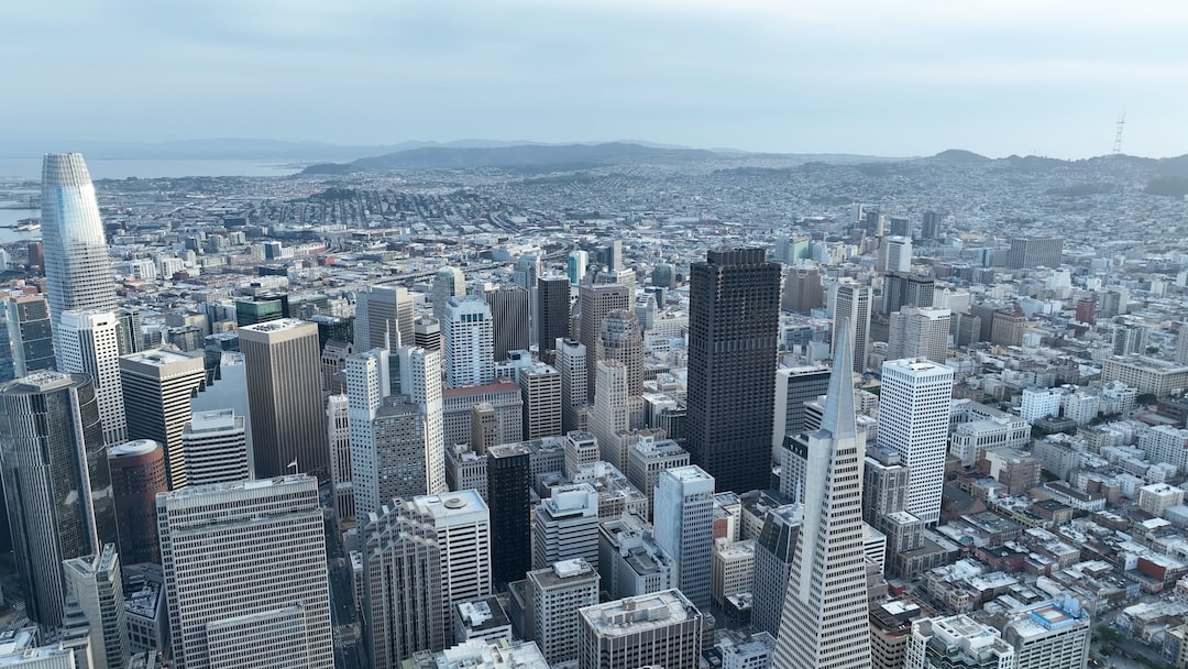 an aerial view of a city with tall buildings