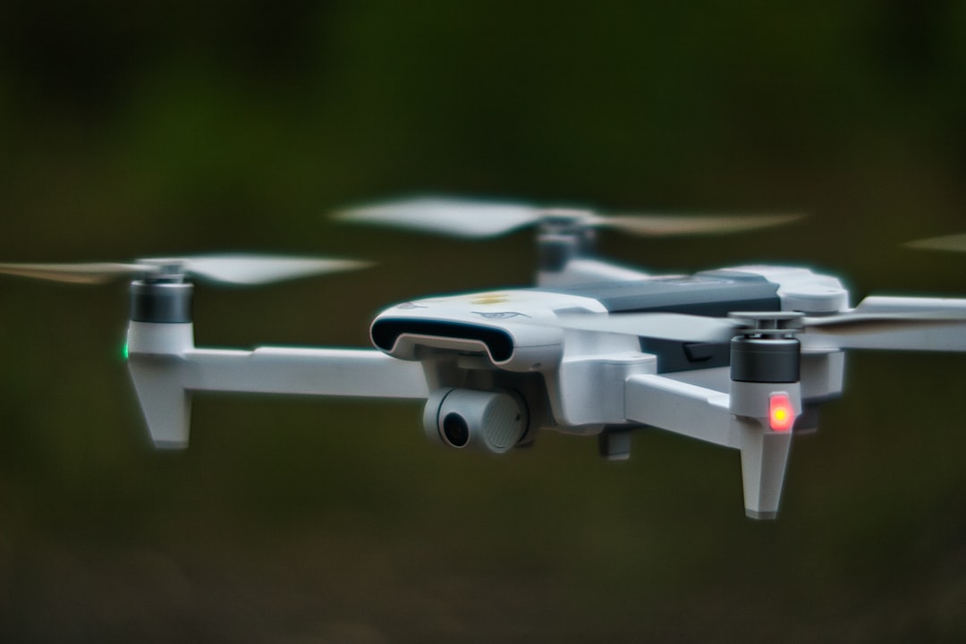 white quadcopter drone in close up photography