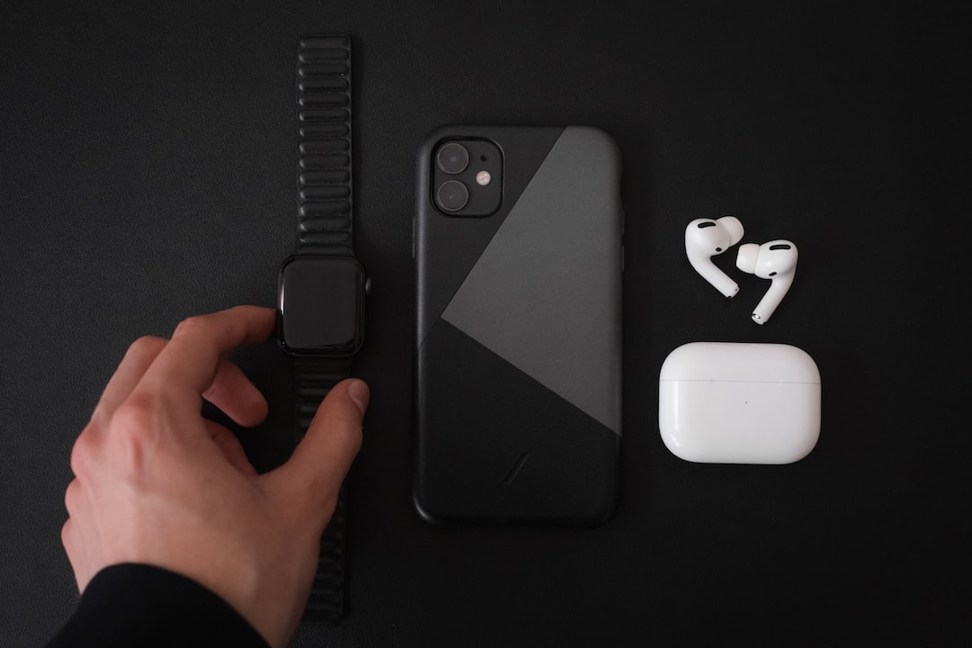 black iphone 7 with white apple airpods