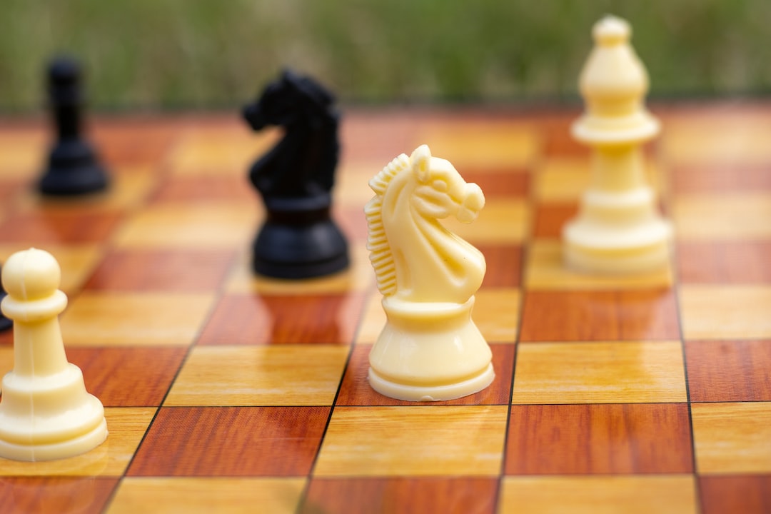 a close up of a chess board with pieces on it