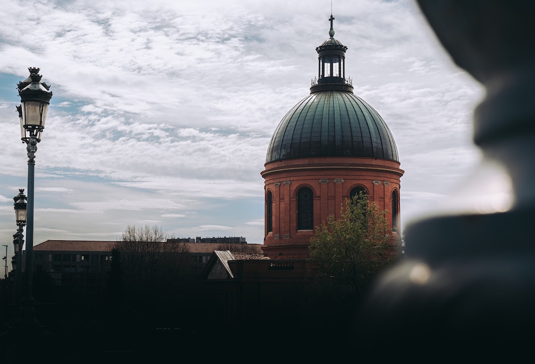 a building with a dome and a street light