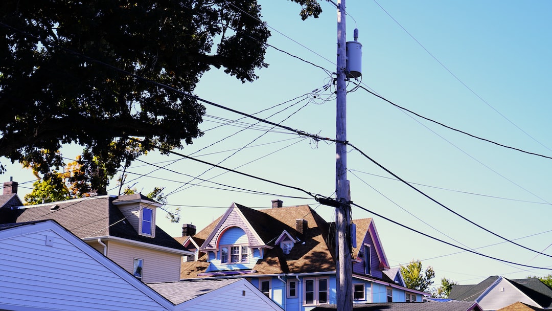 a group of houses with a pole