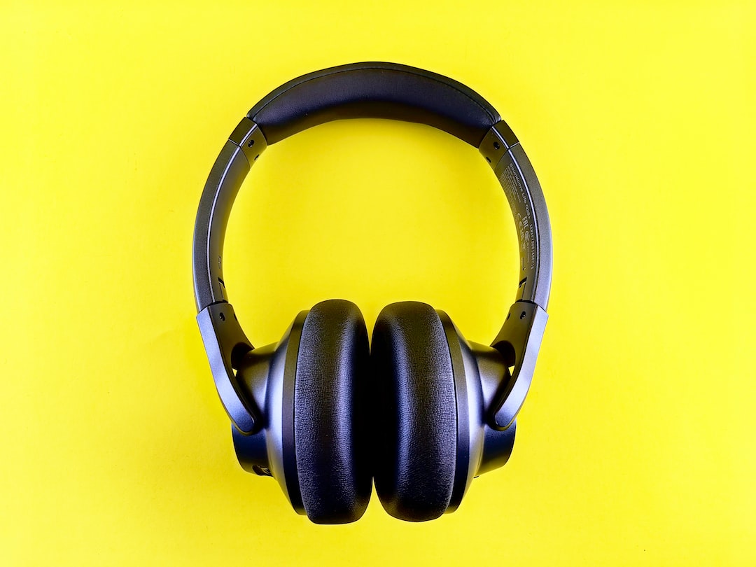 a pair of headphones on a yellow background