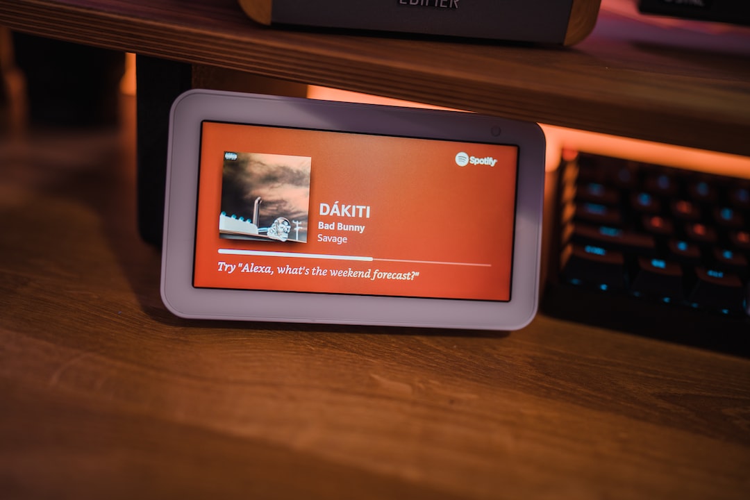 a computer monitor sitting on top of a wooden desk