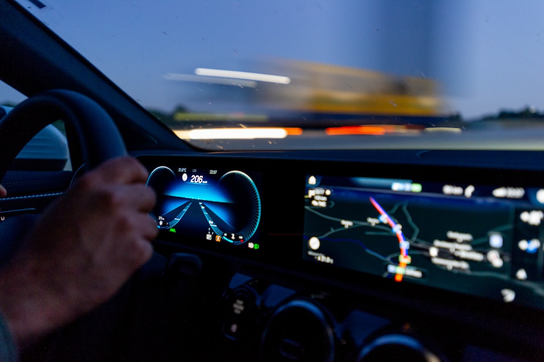 person's hand on steering wheel