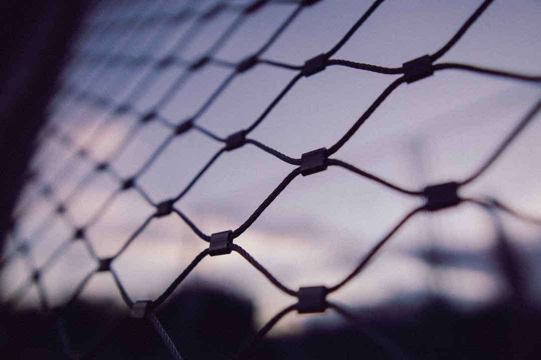 black metal fence with light