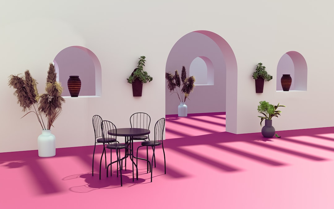 a room with a table and chairs and potted plants