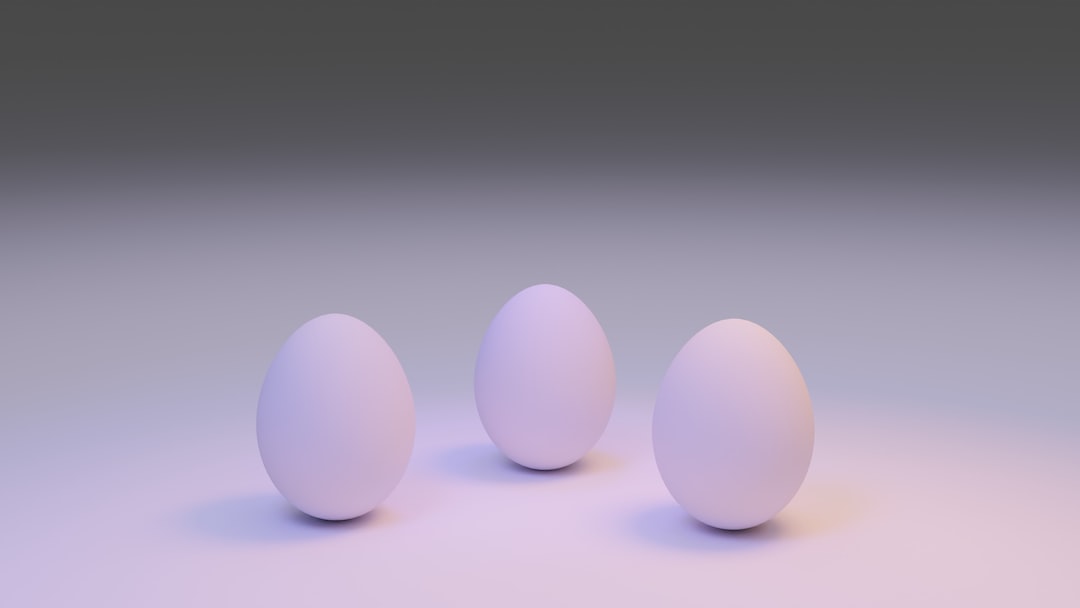 3 white eggs on white surface