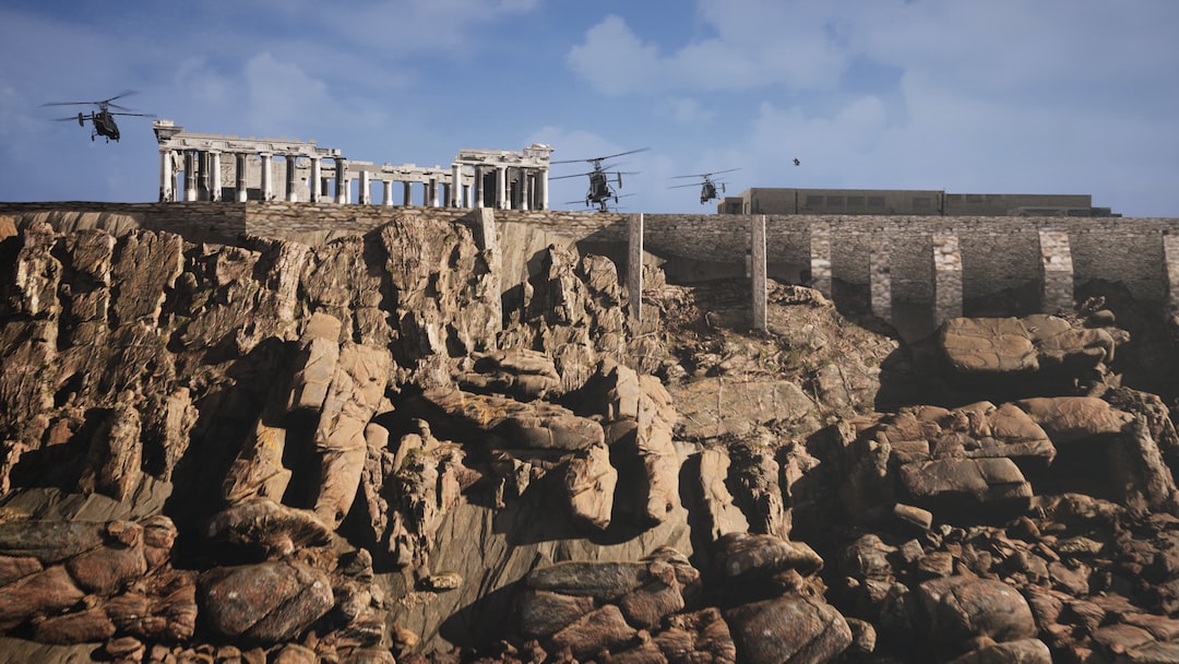 a group of military helicopters flying over a rocky cliff