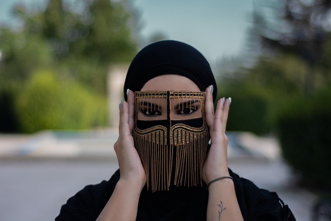 a woman covering her face with a mask