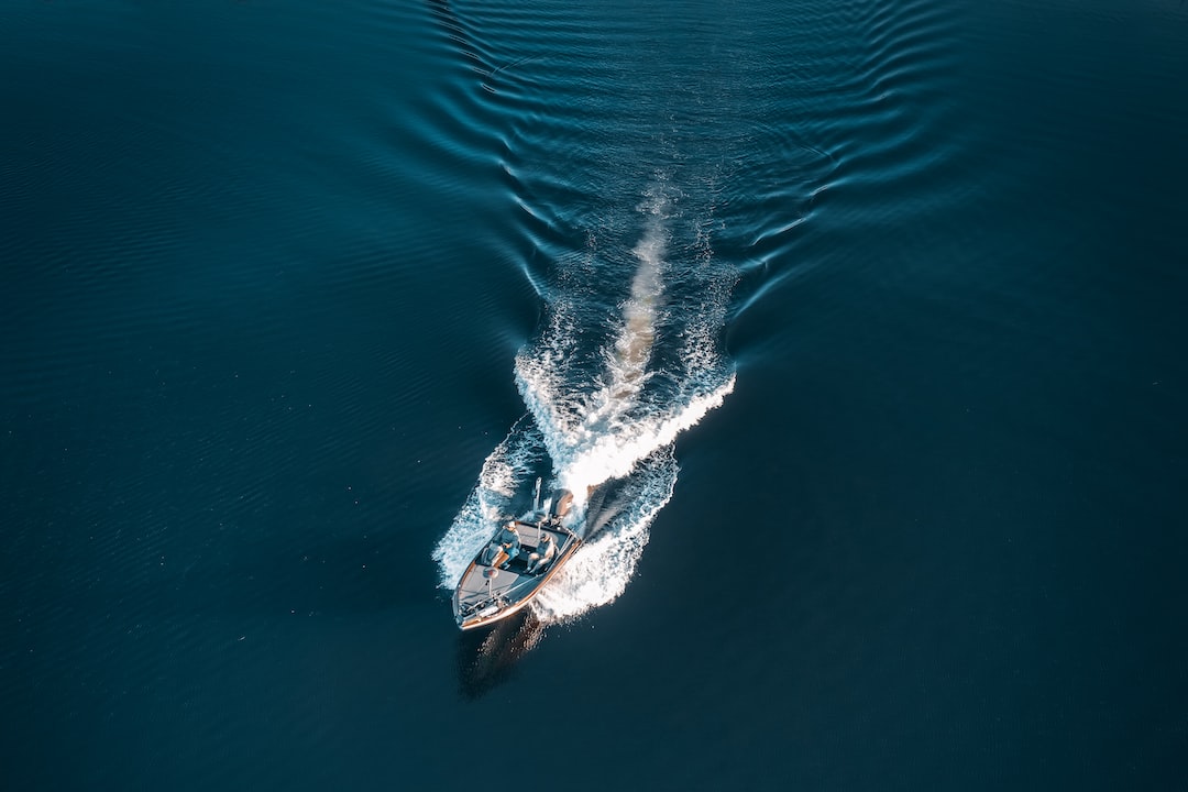 a small boat in the middle of a body of water