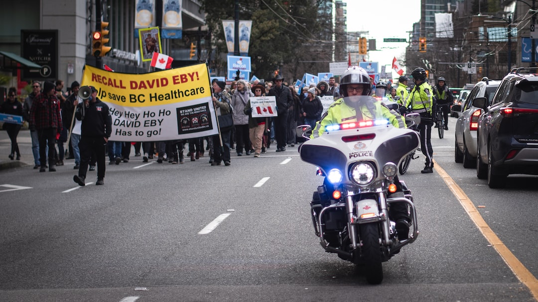 a police officer riding a motorcycle down a street