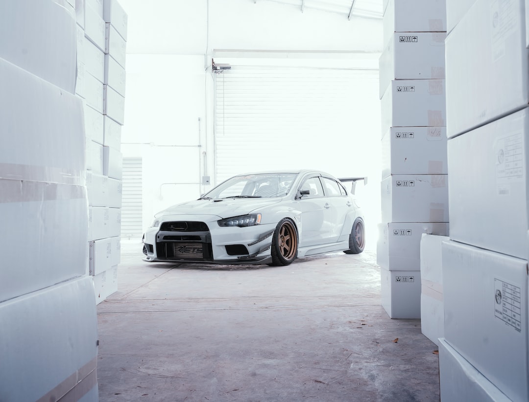 a white car is parked in a garage