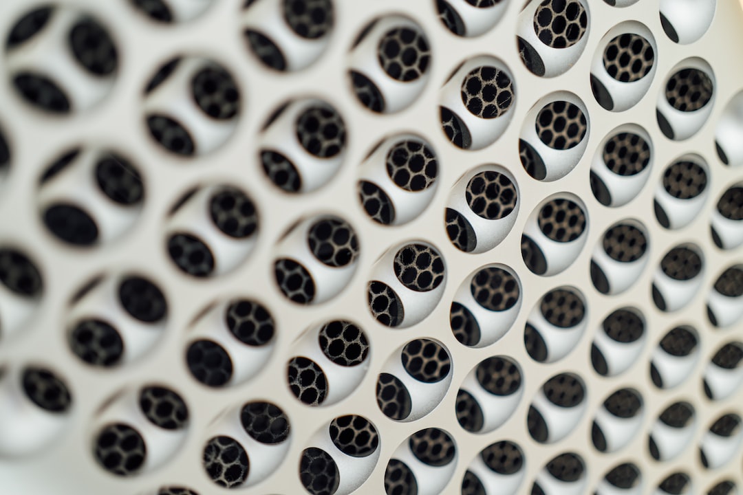 a close up of a wall with holes in it
