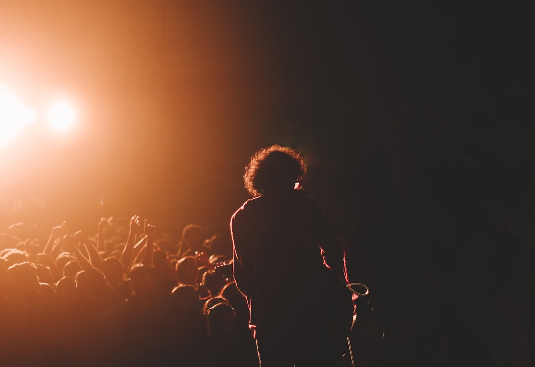 a person on stage with a microphone