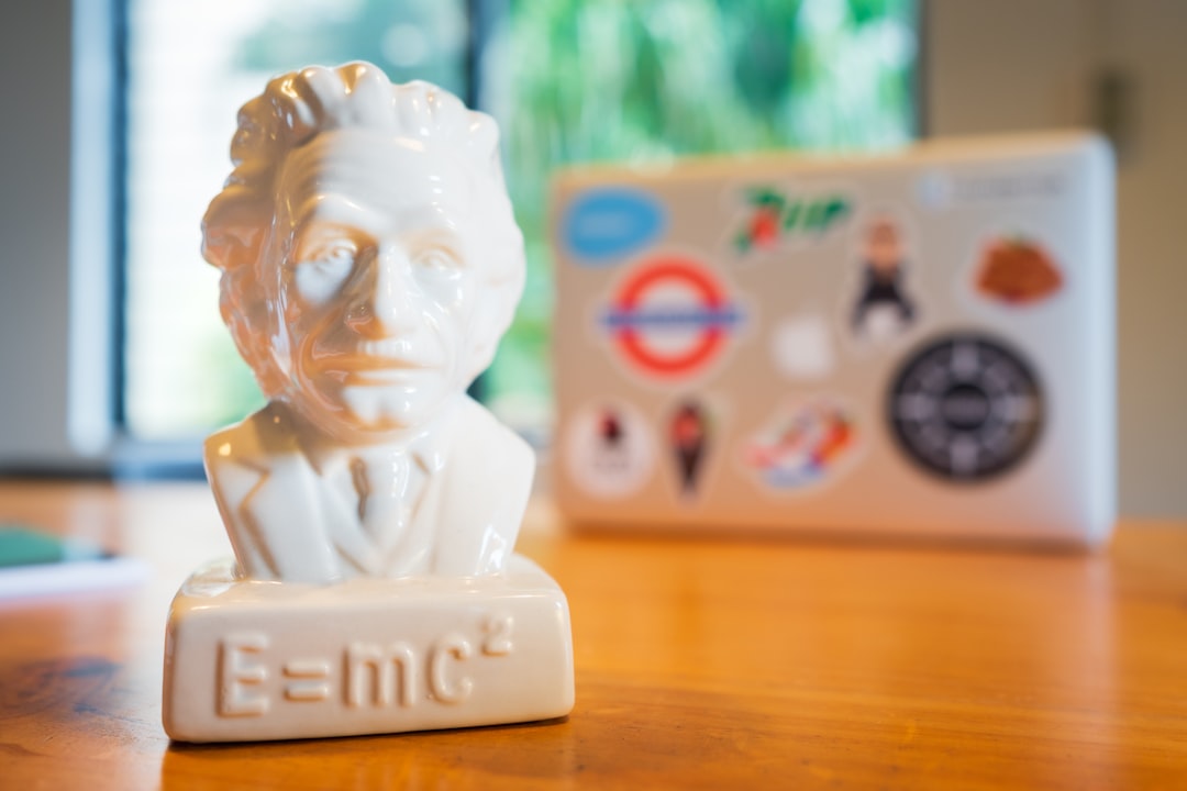 white ceramic figurine on brown wooden table