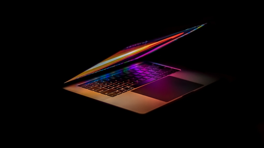 macbook pro on black background