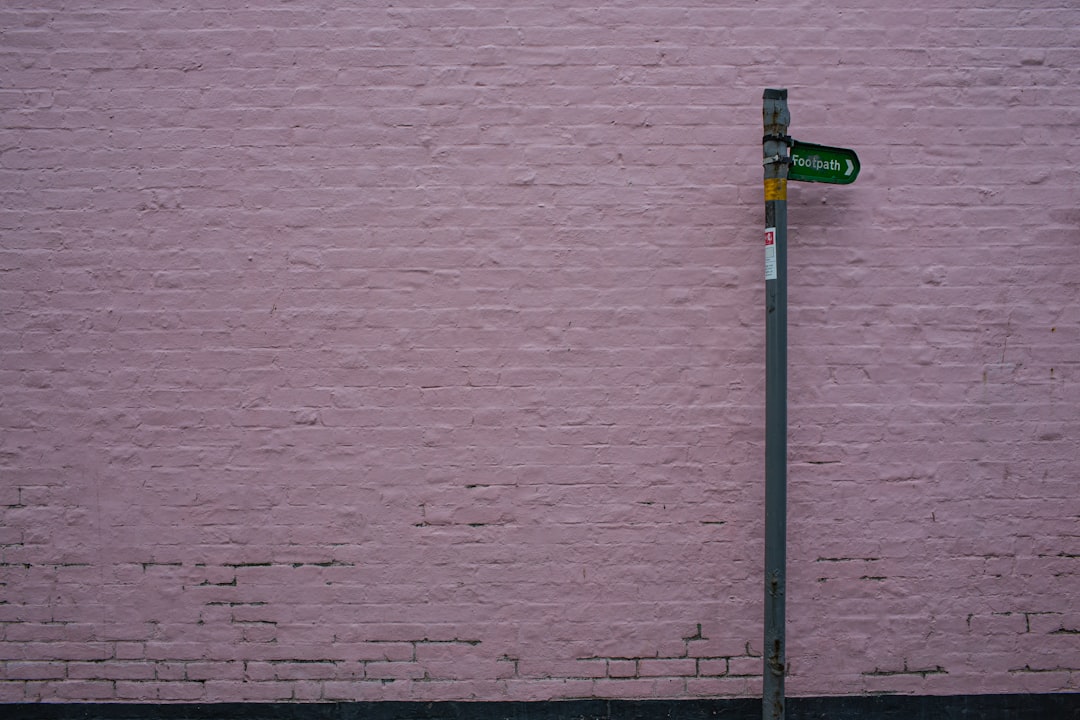 green and grey street sign