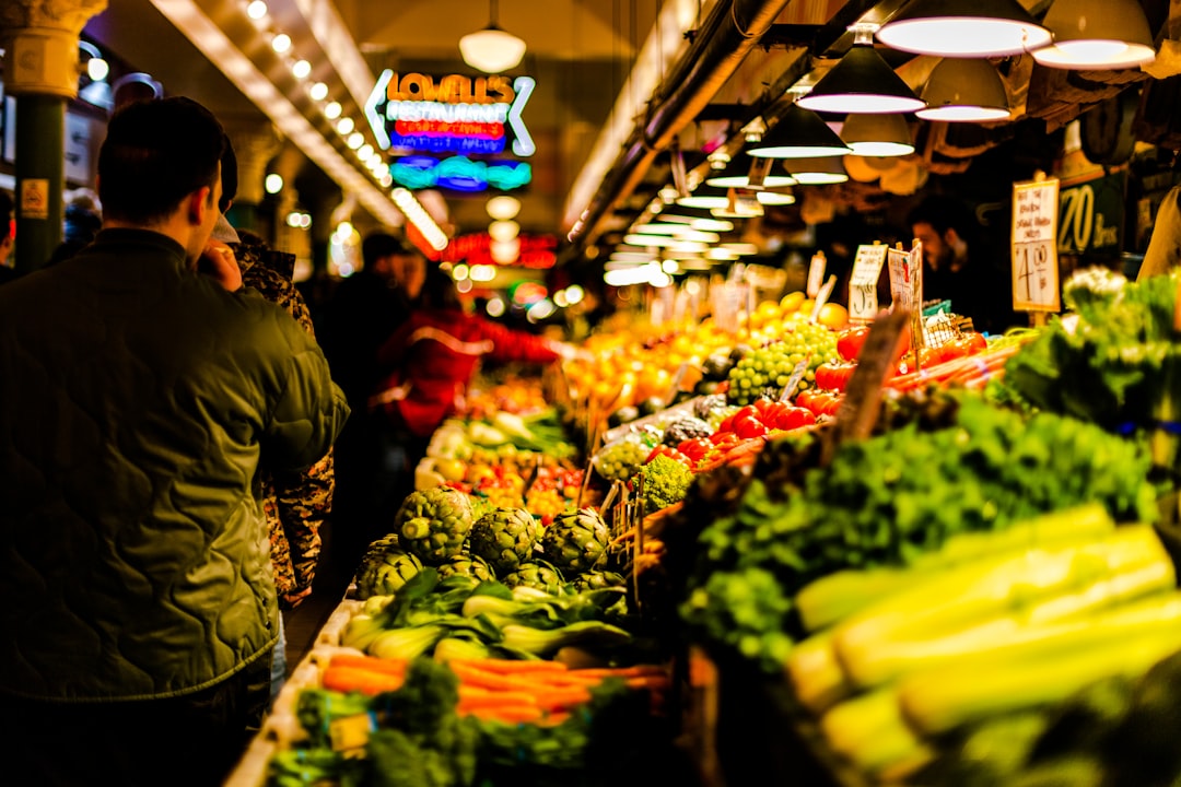 man walking beside vegetables