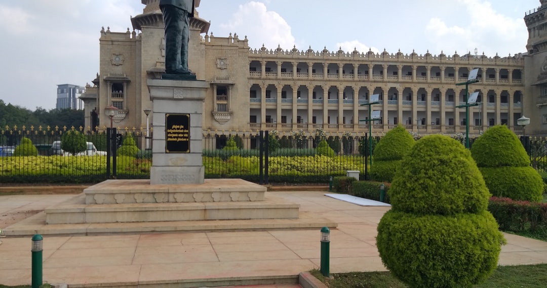 A statue in front of a large building