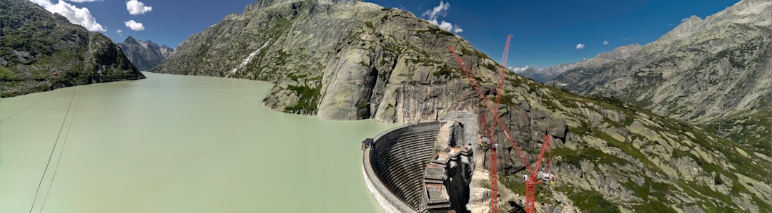 an aerial view of a dam in the mountains