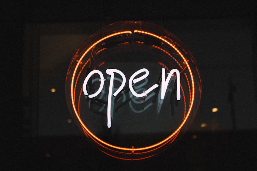 white and orange open LED signage turned on