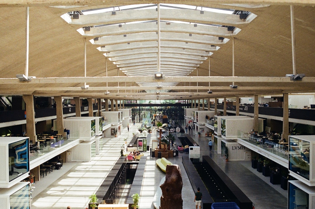 a large open building with lots of tables and chairs