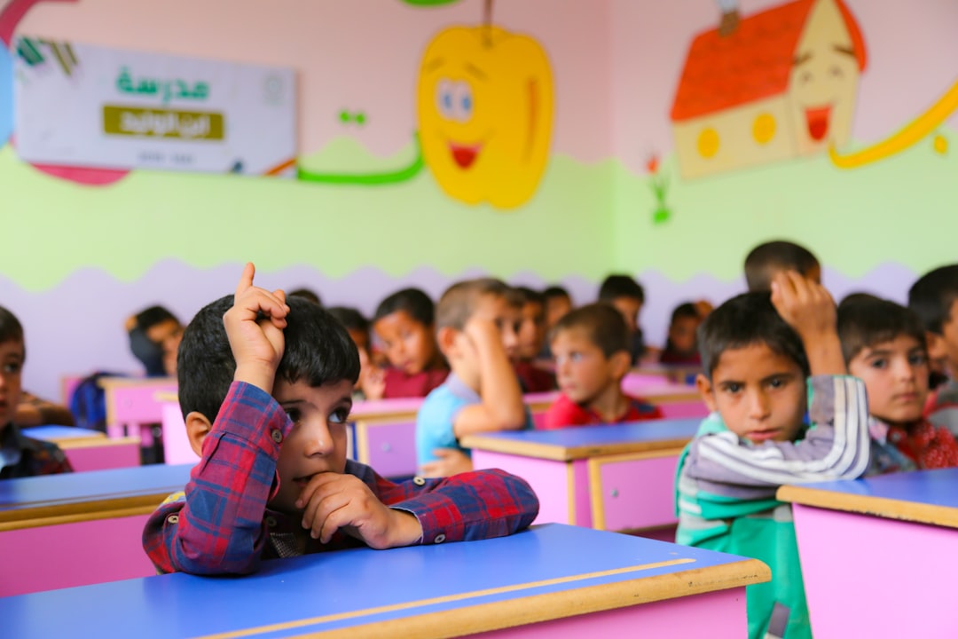 A group of children sitting at desks in a classroom