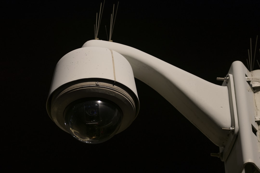 a close up of a security camera on a pole