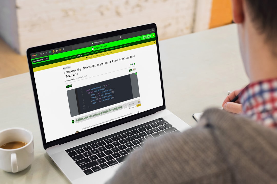 A man sitting in front of a laptop computer