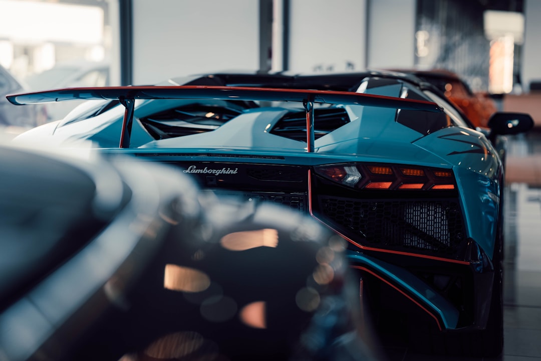 a blue sports car parked in a garage