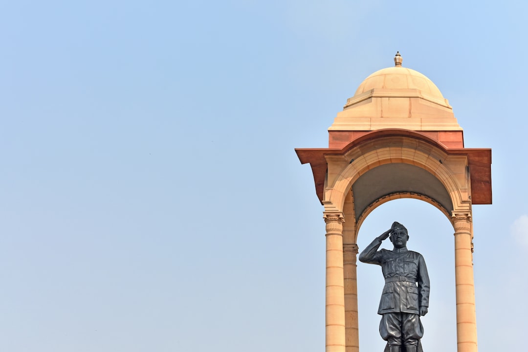 a statue in front of a building